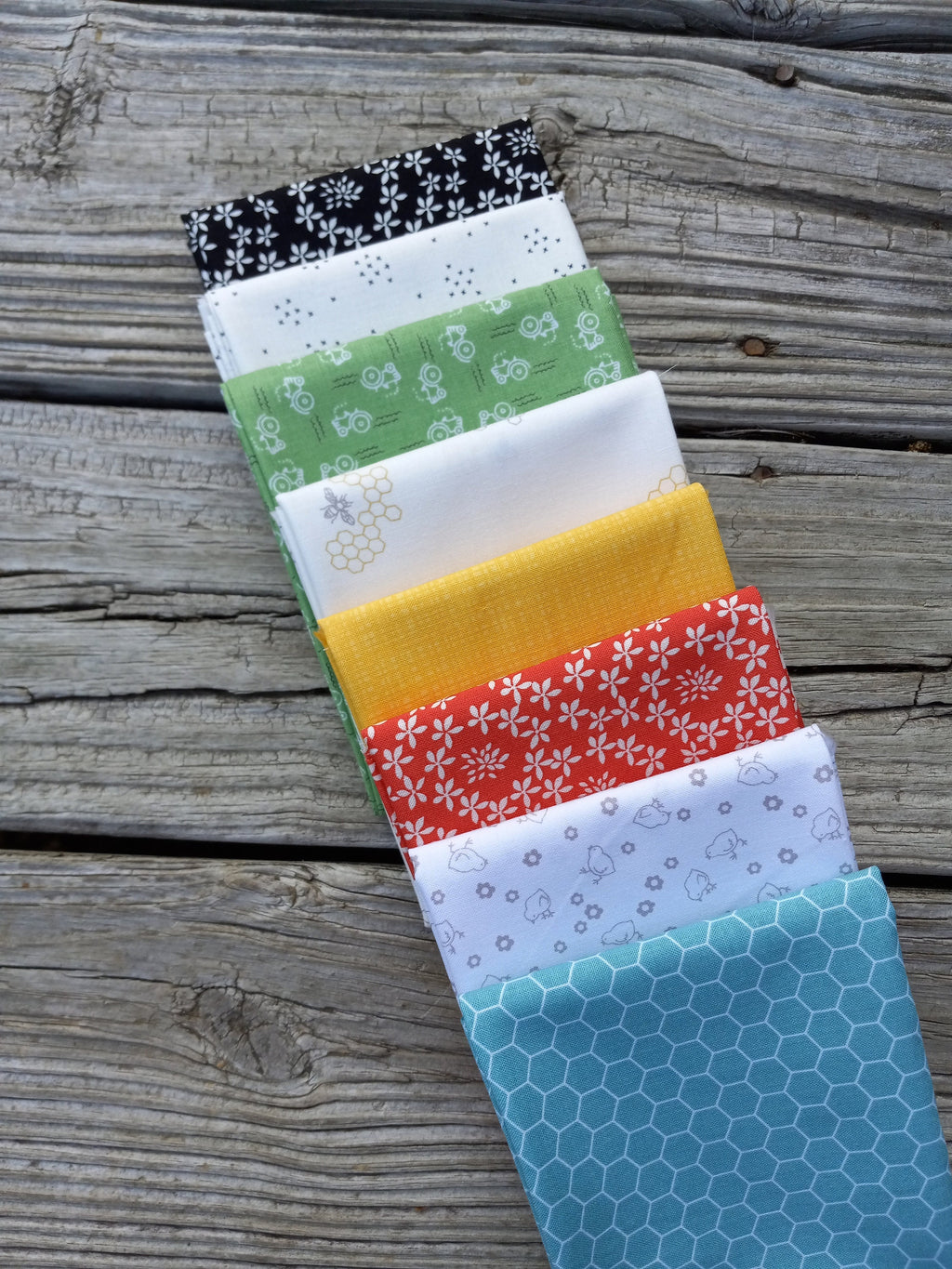 The Lil' Farm Fat Quarter Bundle ft. lil' tractors, chicks, honey bees, and chicken wire prints; 8 piece fabric bundle