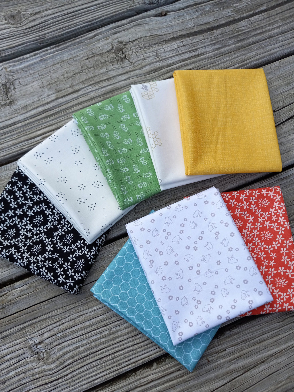 The Lil' Farm Fat Quarter Bundle ft. lil' tractors, chicks, honey bees, and chicken wire prints; 8 piece fabric bundle